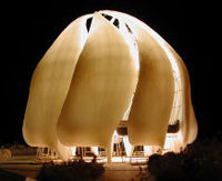 The night view of a model of the new Bah??House of Worship under construction in Chile, showing its translucent alabaster dome.